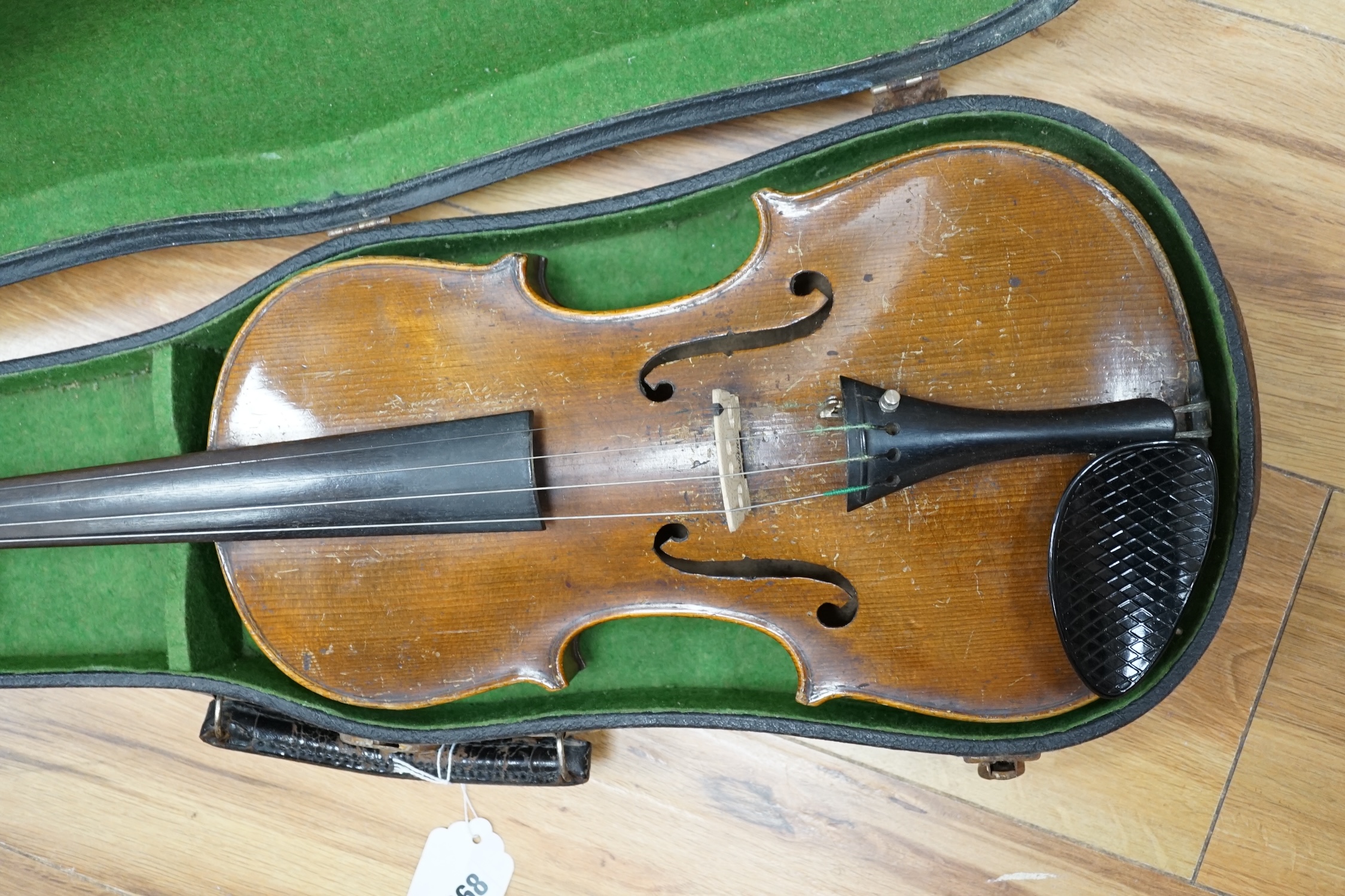 A cased late 19th century violin, back measures 36cm